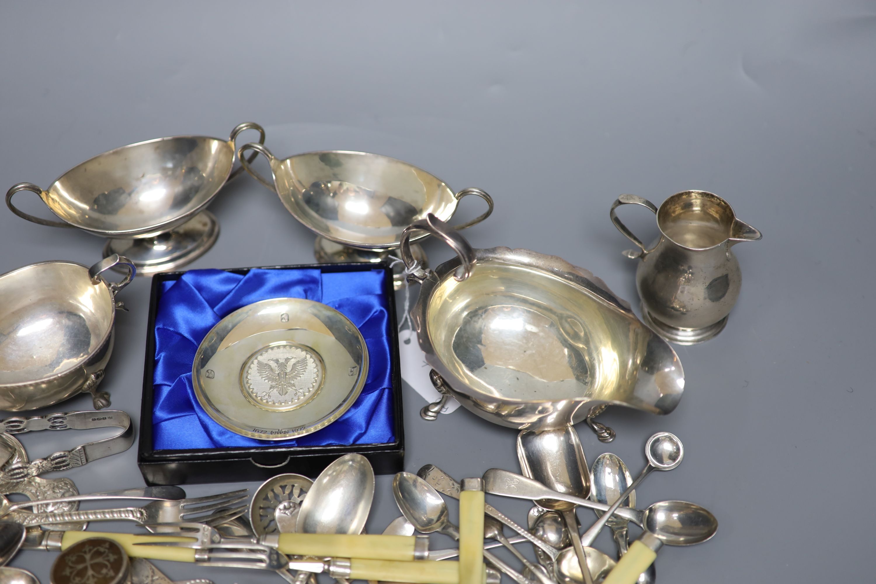 Two George V sauceboats, a pair of George III silver salts, a later sparrow beak cream jug and sundry small silverwares including flatware